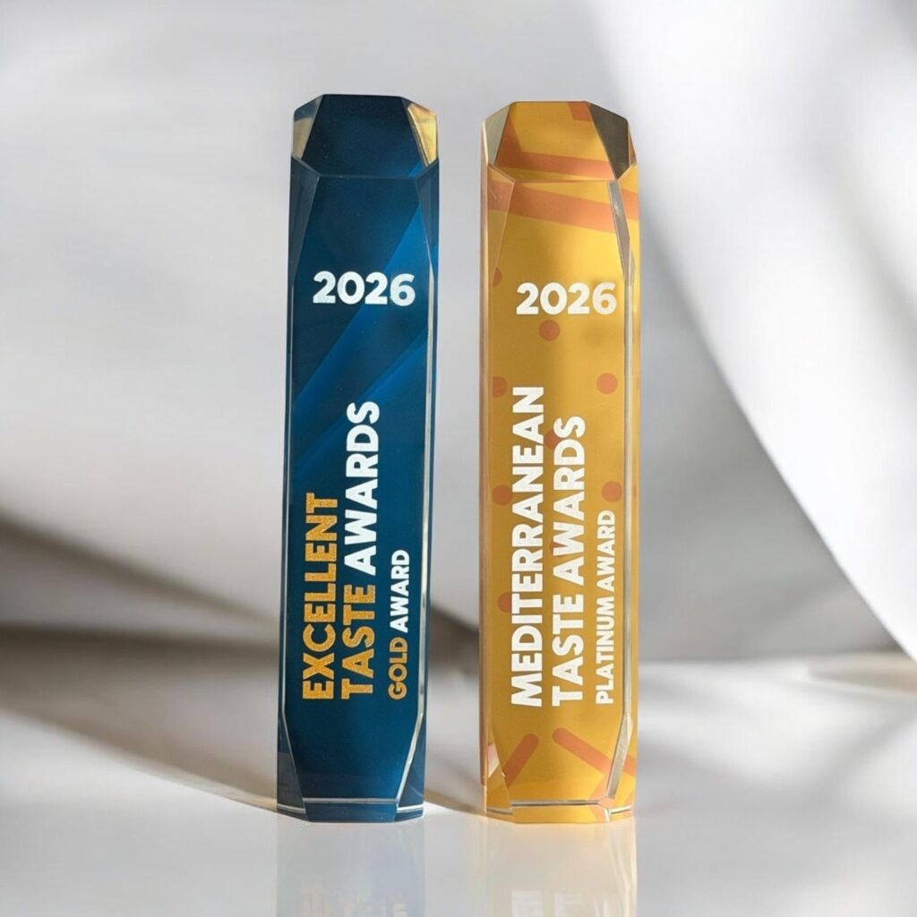Excellent Taste Awards 2026 crystal trophies in blue and gold