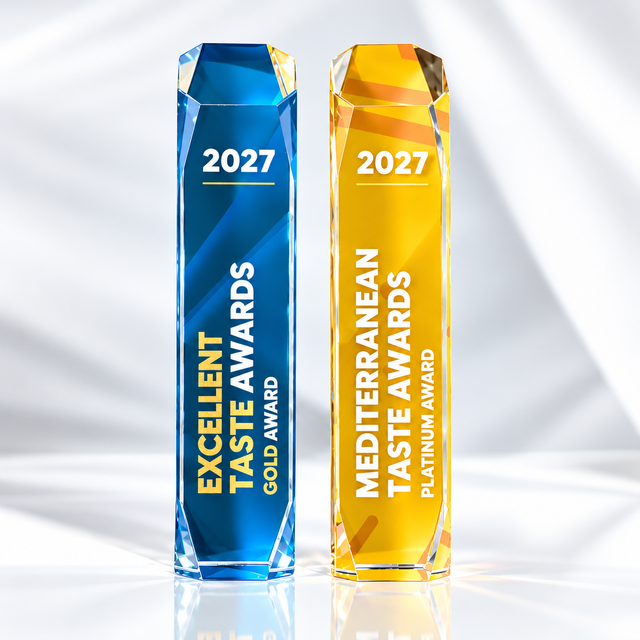Excellent Taste Awards 2027 crystal trophies in blue and gold