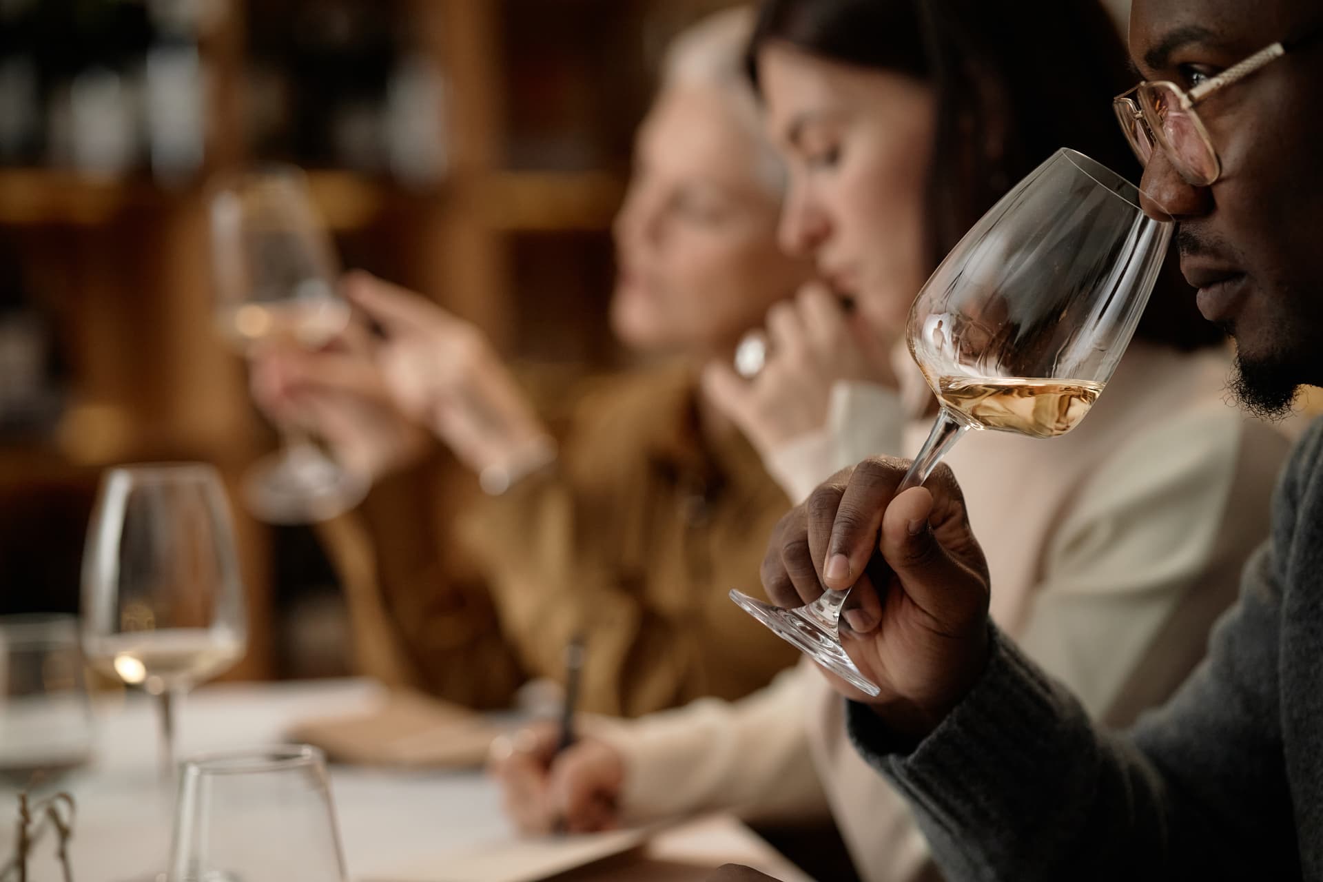 Panel member assessing the aroma of a coded sample at a tasting table